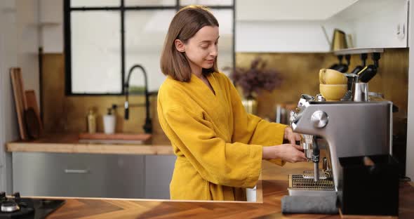 Woman Making Coffee in the Morning at Home