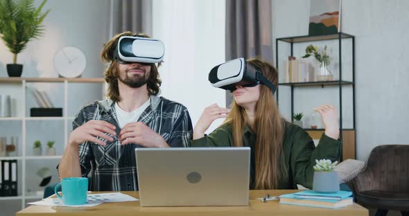 Couple Sitting at the Table at Home and Meditating Under Relaxed Peaceful Vision in VR