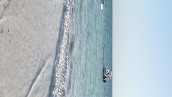 Vertical Video of the Ocean Near the Coast of Zanzibar Tanzania Aerial View