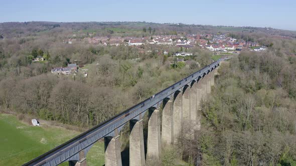 People walk across the beautiful  Narrow Boat canal route called the Pontcysyllte Aqueduct famously