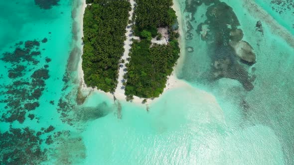 Aerial landscape of paradise resort beach break by blue water and white sand background of a daytrip