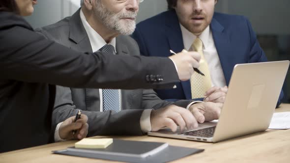 Confident Businesswoman Giving Sticker To Consultant