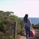 Rear view of young woman walking towards sea, Victoria , Australia - VideoHive Item for Sale