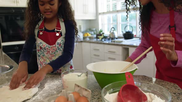 Family making Christmas cookies at home