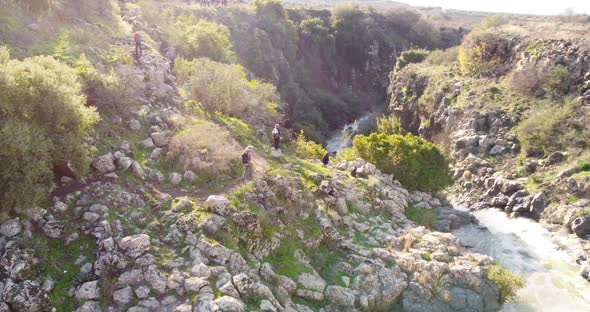 Aerial view of people walking along the Sa'ar river in the forest, Golan Heights, Israel.