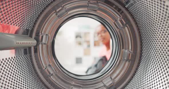 Shot From Inside Washing Machine Drum Woman Opens Door and Packs Colorful Clothes Inside Puts