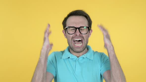 Shouting Angry Man Screaming, Yellow Background