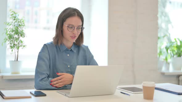 Young Woman Talking on Video Call on Laptop