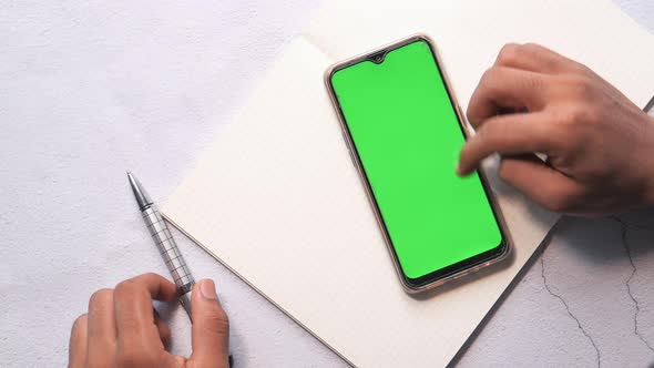 Top View of Man's Hand Using Smart Phone 