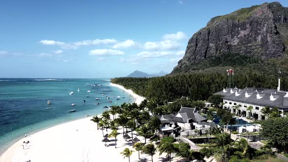 Descending aerial shot of le morne brabant mountain with epic beach,mauritius