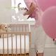 Mother placing baby in crib - VideoHive Item for Sale