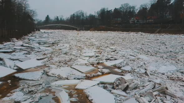 Aerial Dron Shot of the Huge Ice Loads Drift in the River Ogre, Latvia. 4K Video