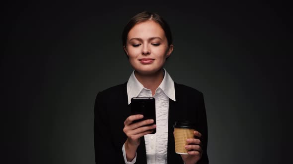 Attractive Brunette Business Woman Texting and Smiling