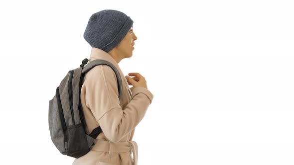 Woman with Backpack in Outdoor Clothes Walking and Coughing on White Background