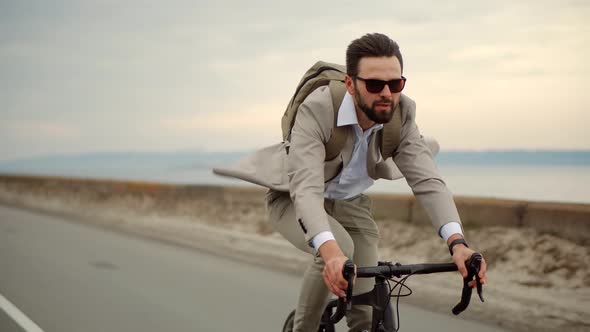 Businessman Commuter On Bicycle Traveling Work. Businesspeople Commute Lifestyle. Man Riding Bike.
