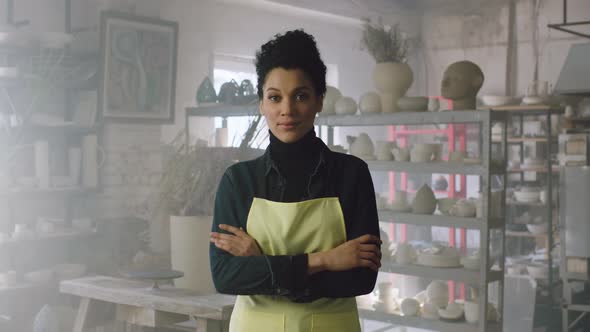 Woman Is Standing In Pottery Workshop