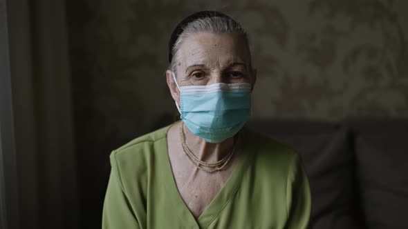 Grandmother in Face Mask Lat Home