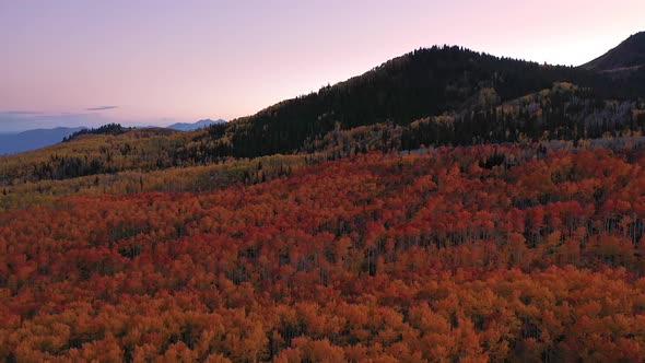 Aerial view at dusk looking over valley towards mountains in the Fall