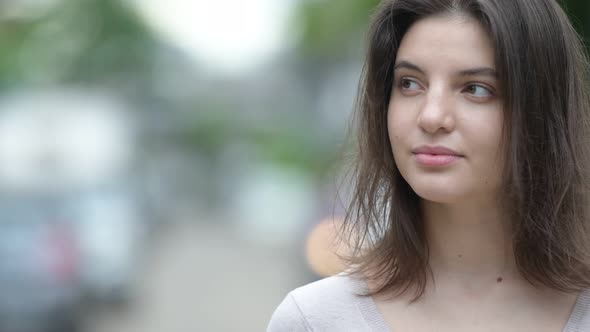 Young Beautiful Woman Thinking in the Streets Outdoors