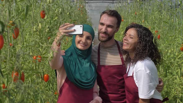 Happy Diverse Hothouse Workers Smiling for Selfie