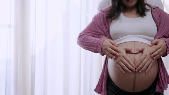 Pregnant Couple Feels Love and Relax at Home