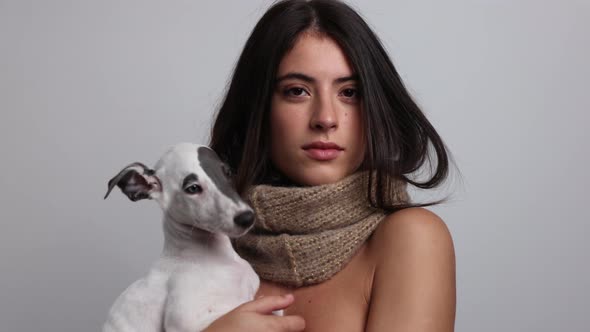 Woman Posing and Dancing in Knitwear Scarf Holding Dog