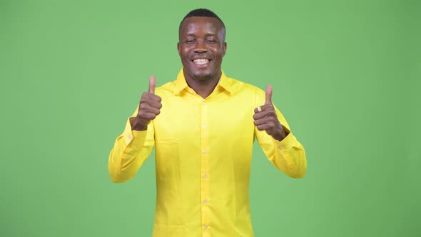 Young Happy African Businessman Giving Thumbs Up