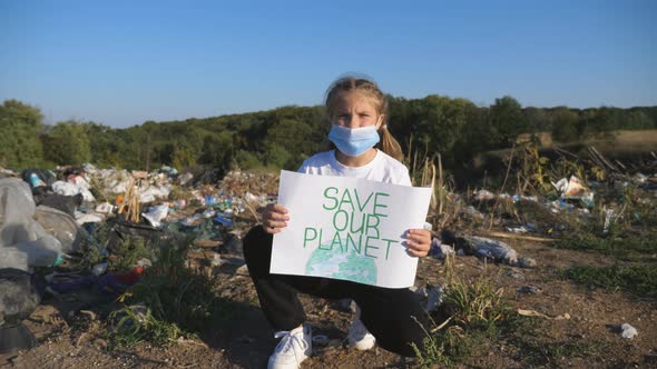 Small Girl Holding in Hands Placard of Environmental Movement for Saving Earth