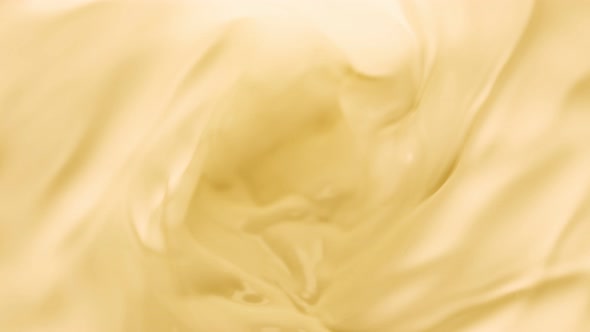 Super Slow Motion Shot of Swirling Yellow Milky Wortex at 1000Fps.