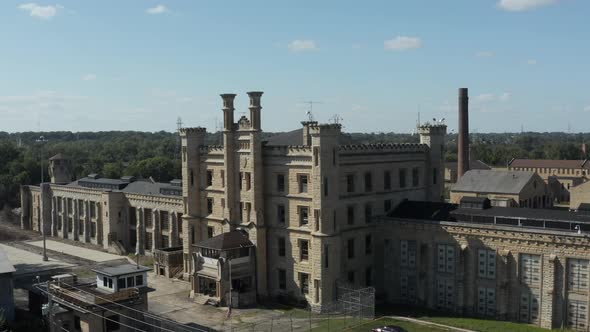 Aerial view of the old and abandoned Joliet prison or jail, a historic site since 1880s. Drone rotat