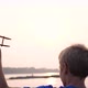 the Child Holds a Plane in His Hand Against the Setting Sun Simulates the Flight - VideoHive Item for Sale