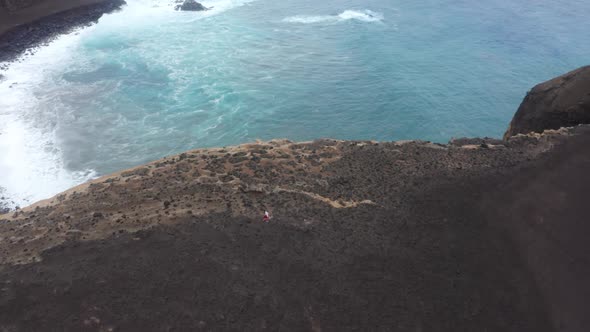 Man Hiking at Capelinhos Volcano Crater Faial Island Azores Portuga Europe