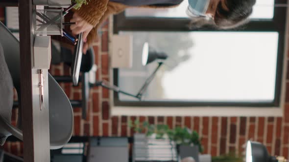 Business Woman Putting Laptop at Desk and Working on Project