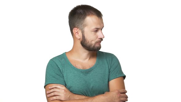 Slow Motion Portrait of Caucasian Adult Darkhaired Guy Standing with Crossed Hands Thinking Hard