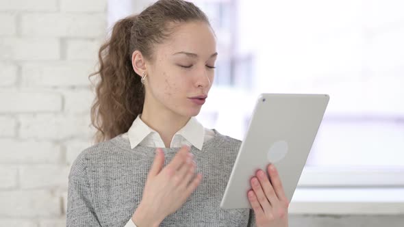 Portrait of Beautiful Young Latin Woman Doing Video Chat on Tablet