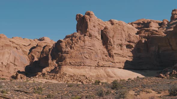 Red Orange Massive Rock Formation In Arches Park On A Sunny Day In Motion