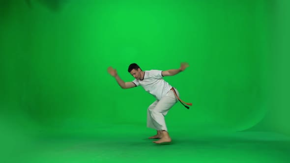 Man Practicing Capoeira on Chroma Key Studio. Slow Motion.