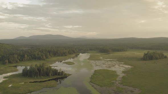 Wide wilderness landscape ascending aerial Shirley Bog, Maine