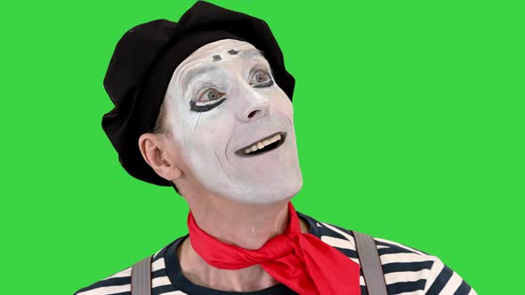 Mime in White Gloves Performs Something on a Green Screen Chroma Key