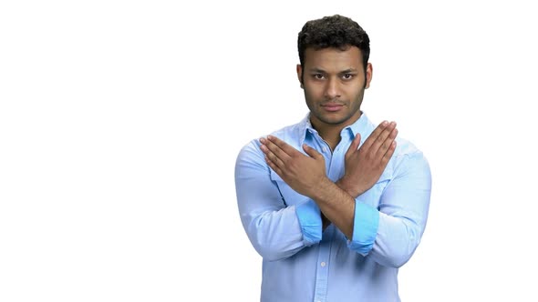 Young Man Showing Stop Gesture with Hands