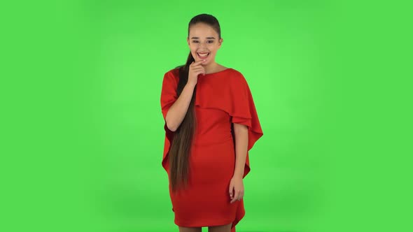 Pretty Young Woman Confused Saying Oops and Shrugging. Green Screen