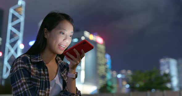 Woman use of mobile phone at night