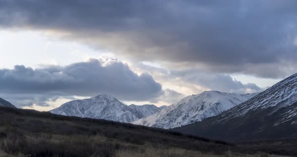 Timelapse of Epic Clouds at Mountain Medow at Autumn Time. Wild Endless Nature with Snow Storm Sky