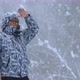 Man Stands Alone Against White Snowstorm and Snow Storm a Snowfall - VideoHive Item for Sale
