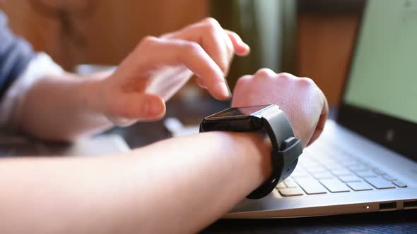 Extreme close up woman hands using smart watch