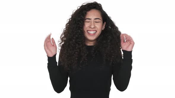 Portrait of Cheerful Woman Being Ecstatic Rejoicing Like Winner Being Glad with Good News Over White