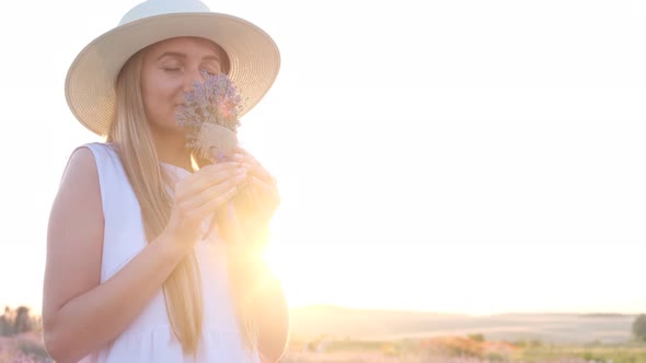 Young Girl in Lavender Fields on a Sunny Day in the Countryside