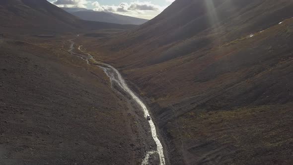 Aerial View of the Canyon and Mountains The River Flows and the Sunbeam Shines Beautifully in The