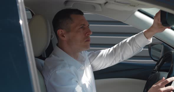 Portrait of Mature Ceo Executive Sitting in a Car on Drivers Seat