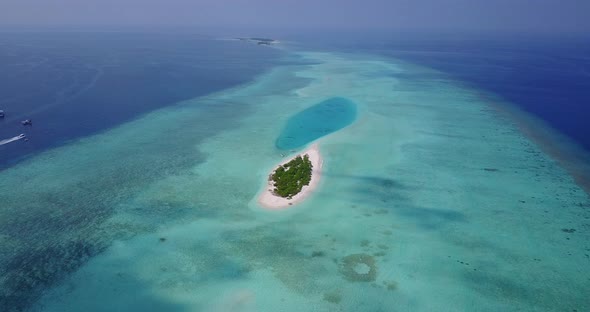 Tropical overhead abstract view of a summer white paradise sand beach and blue sea background in 4K